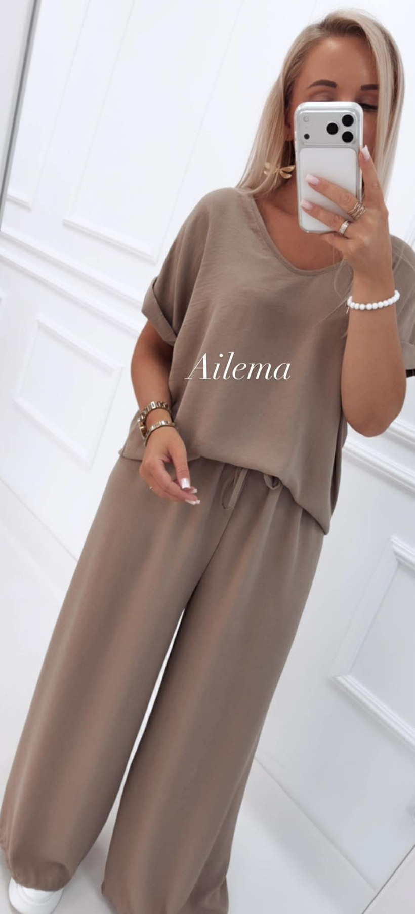 Komplet kreszowany KM877 bluzka z ozdobnym wycięciem i spodnie szeroka nogawka  