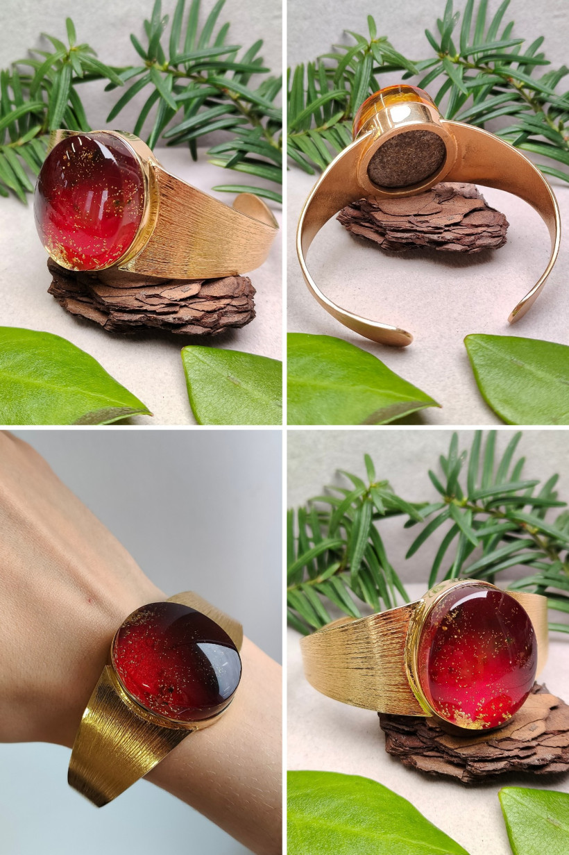 Bransoletka z bursztynem bałtyckim – unikatowa ręcznie robiona biżuteria z dużym czerwonym oczkiem, złoty mankiet