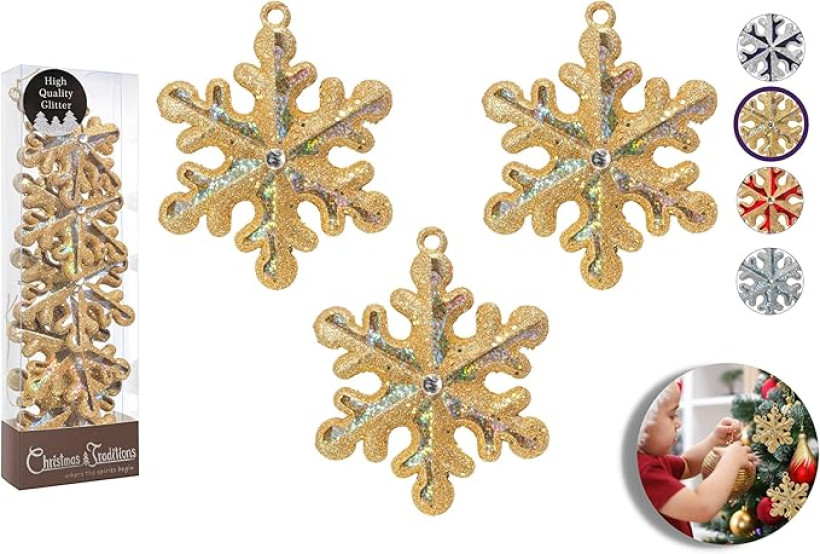 Opakowanie złotych, brokatowych ozdób choinkowych w kształcie płatków śniegu.